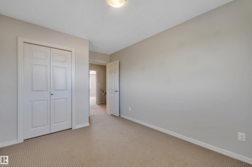 #1 5101 Soleil Bv, Beaumont, AB - Indoor Photo Showing Other Room