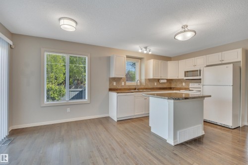 #1 5101 Soleil Bv, Beaumont, AB - Indoor Photo Showing Kitchen