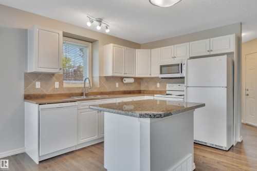#1 5101 Soleil Bv, Beaumont, AB - Indoor Photo Showing Kitchen