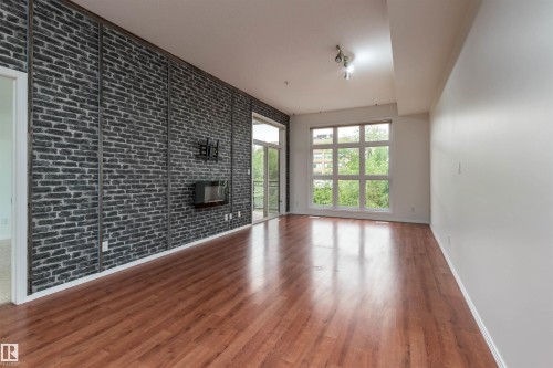 #321 10407 122 St Nw, Edmonton, AB - Indoor Photo Showing Other Room With Fireplace