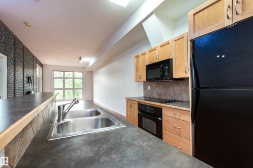 #321 10407 122 St Nw, Edmonton, AB - Indoor Photo Showing Kitchen With Double Sink