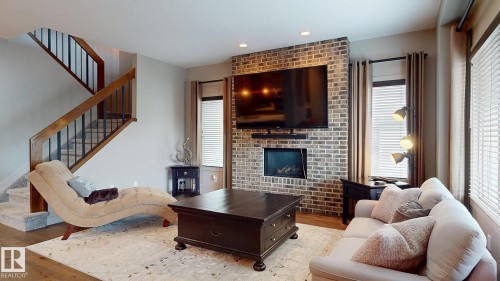 223 Hawks Ridge Boulevard Nw, Edmonton, AB - Indoor Photo Showing Living Room With Fireplace