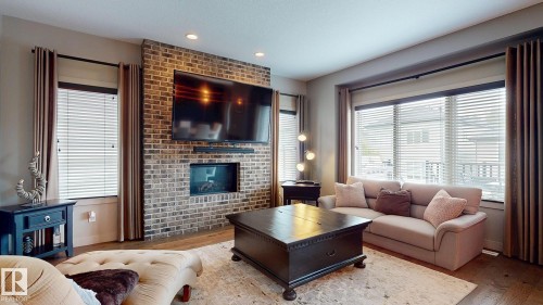 223 Hawks Ridge Boulevard Nw, Edmonton, AB - Indoor Photo Showing Living Room With Fireplace