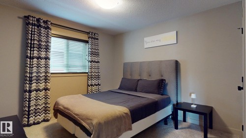 223 Hawks Ridge Boulevard Nw, Edmonton, AB - Indoor Photo Showing Bedroom