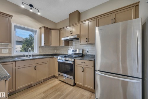 #23 5102 30 Av, Beaumont, AB - Indoor Photo Showing Kitchen With Double Sink