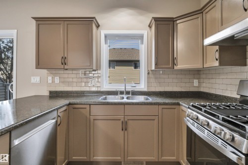 #23 5102 30 Av, Beaumont, AB - Indoor Photo Showing Kitchen With Double Sink