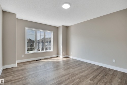 #23 5102 30 Av, Beaumont, AB - Indoor Photo Showing Other Room