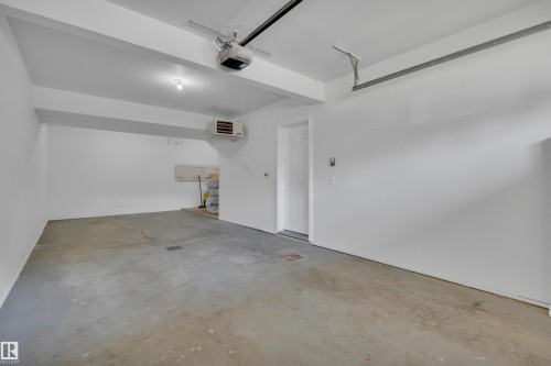 #23 5102 30 Av, Beaumont, AB - Indoor Photo Showing Garage