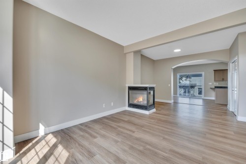 #23 5102 30 Av, Beaumont, AB - Indoor Photo Showing Living Room With Fireplace