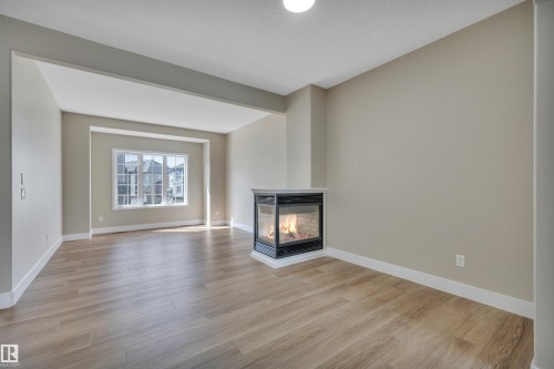 #23 5102 30 Av, Beaumont, AB - Indoor Photo Showing Living Room With Fireplace