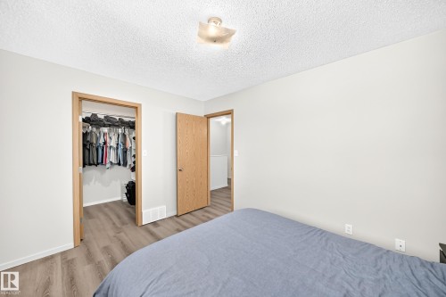 View of Walk in Closet. - #158 180 Bridgeport Bv, Leduc, AB - Indoor Photo Showing Bedroom