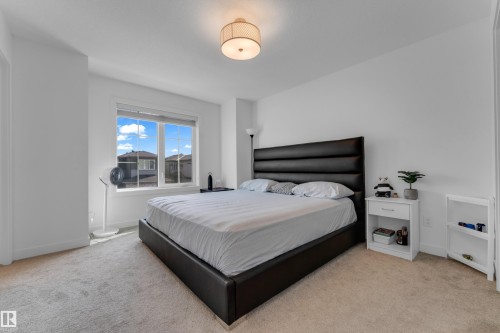 Recessed lighting, large window, neutral carpet, and white walls - 3610 42 Avenue, Beaumont, AB - Indoor Photo Showing Bedroom