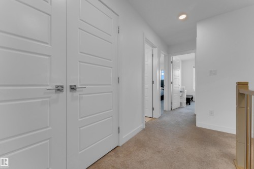 Hallway with carpeting and recessed lighting - 3610 42 Avenue, Beaumont, AB - Indoor Photo Showing Other Room