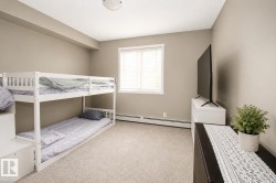 Recessed lighting, wall-to-wall carpeting, and a window with blinds - 