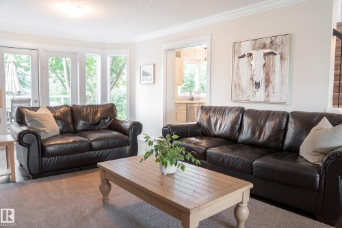Recessed ceiling lighting, crown molding, and light-colored walls - 56 Highridge Way, Stony Plain, AB - Indoor Photo Showing Living Room