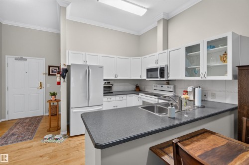 #112 78 Mckenney Av, St. Albert, AB - Indoor Photo Showing Kitchen With Double Sink