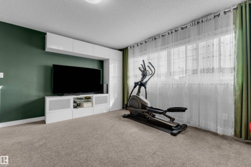 6945 Evans Wynd Nw, Edmonton, AB - Indoor Photo Showing Gym Room