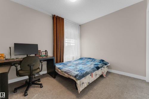 6945 Evans Wynd Nw, Edmonton, AB - Indoor Photo Showing Bedroom