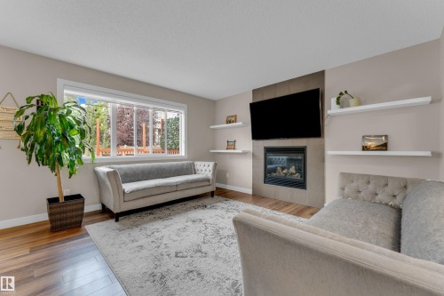 6945 Evans Wynd Nw, Edmonton, AB - Indoor Photo Showing Living Room With Fireplace