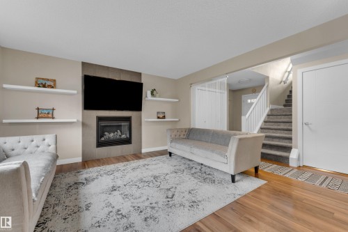 6945 Evans Wynd Nw, Edmonton, AB - Indoor Photo Showing Living Room With Fireplace