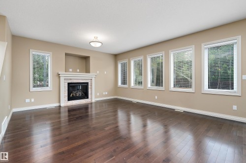 Living room - 11203 72 Avenue Nw, Edmonton, AB - Indoor Photo Showing Living Room With Fireplace