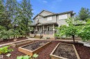 Two-story residence featuring light gray siding, white trim, and a covered porch with white columns - 11203 72 Avenue Nw, Edmonton, AB  - Outdoor With Deck Patio Veranda 