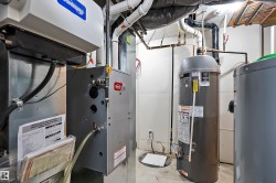 Dedicated utility room featuring essential systems - 