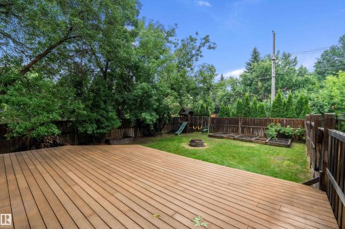 Spacious outdoor deck with wood-finish planks - 11203 72 Avenue Nw, Edmonton, AB - Outdoor With Backyard