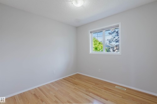 Hardwood flooring, painted walls, single window, and overhead lighting - 21332 89 Avenue Nw, Edmonton, AB - Indoor Photo Showing Other Room