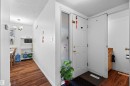 White entry door with frosted glass sidelight - 2730 105 Street Nw, Edmonton, AB  - Indoor Photo Showing Other Room 