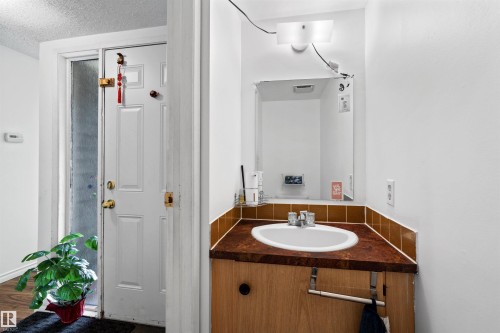 White paneled door with frosted glass insert - 2730 105 Street Nw, Edmonton, AB - Indoor Photo Showing Bathroom