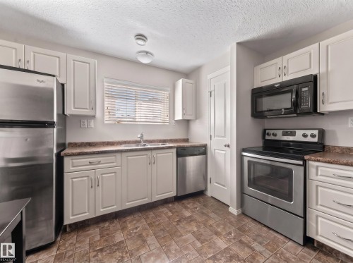 110 26 Street, Cold Lake, AB - Indoor Photo Showing Kitchen With Double Sink