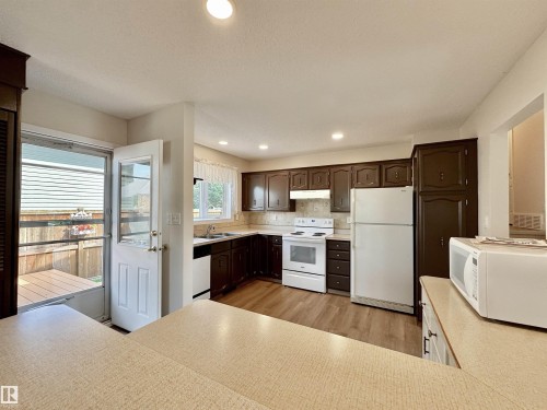 2423 83 Street Nw, Edmonton, AB - Indoor Photo Showing Kitchen With Double Sink