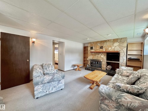 2423 83 Street Nw, Edmonton, AB - Indoor Photo Showing Living Room With Fireplace