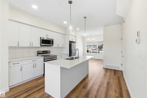 4582 Warbler Loop Nw, Edmonton, AB - Indoor Photo Showing Kitchen With Stainless Steel Kitchen With Double Sink With Upgraded Kitchen
