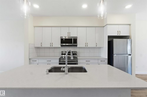 4582 Warbler Loop Nw, Edmonton, AB - Indoor Photo Showing Kitchen With Double Sink With Upgraded Kitchen