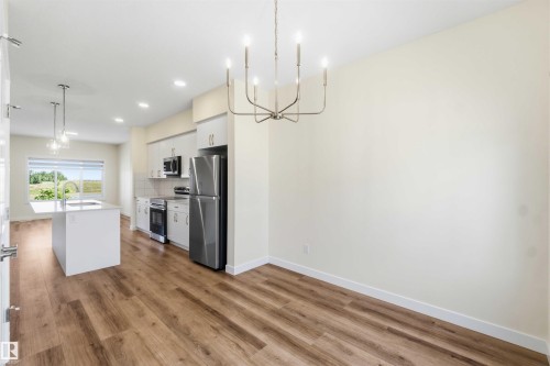 4582 Warbler Loop Nw, Edmonton, AB - Indoor Photo Showing Kitchen With Stainless Steel Kitchen With Upgraded Kitchen