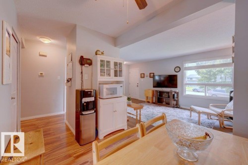 Wood-finish flooring, white trim, and a large window providing ample natural light - 307 Northgate Terrace Nw, Edmonton, AB - Indoor