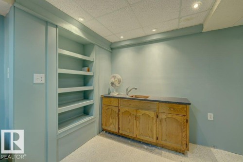 Built-in shelving, wood cabinetry, integrated sink, and recessed lighting - 307 Northgate Terrace Nw, Edmonton, AB - Indoor Photo Showing Other Room
