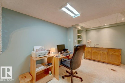 Built-in cabinetry with a countertop and sink, integrated shelving, and recessed lighting - 307 Northgate Terrace Nw, Edmonton, AB - Indoor Photo Showing Office