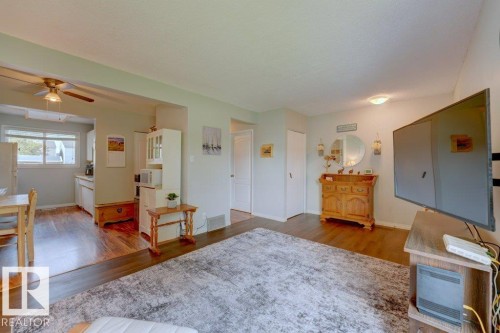 Wood-finish flooring throughout, light-toned wall paint, and recessed ceiling lighting - 307 Northgate Terrace Nw, Edmonton, AB - Indoor Photo Showing Other Room