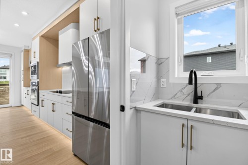 8790 Mayday Lane Sw, Edmonton, AB - Indoor Photo Showing Kitchen With Double Sink With Upgraded Kitchen