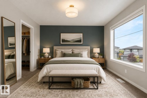 Recessed closet with a wood-finish interior, a large window, a ceiling-mounted light fixture, and a dark accent wall - 2355 Kelly Circle Circle Sw, Edmonton, AB - Indoor Photo Showing Bedroom