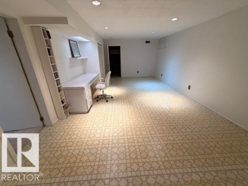 Spacious room featuring patterned tile flooring and recessed lighting - 6824 89 Avenue Nw, Edmonton, AB - Indoor Photo Showing Other Room
