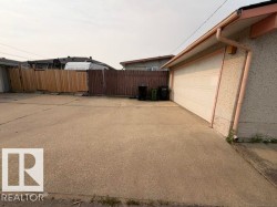 Expansive concrete driveway providing direct access to the attached garage - 