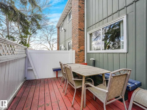 Private outdoor deck featuring red-stained wood planks - 13405 40 St Nw, Edmonton, AB - Outdoor With Deck Patio Veranda With Exterior
