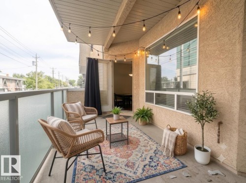 Private balcony with durable stucco exterior and frosted privacy panels - #103 8108 109 St Nw, Edmonton, AB 