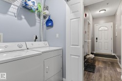 Dedicated laundry area with washer and dryer, complemented by wire shelving - 