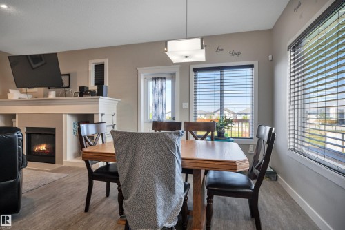 956 Morris Way, Leduc, AB - Indoor Photo Showing Dining Room With Fireplace