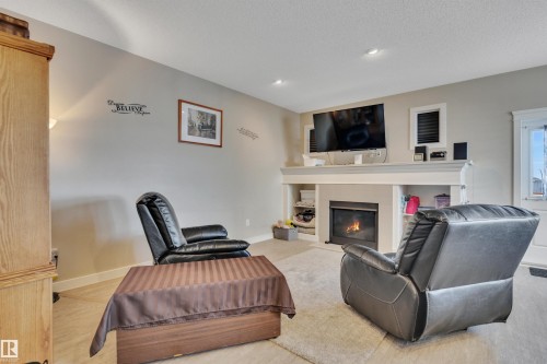 956 Morris Way, Leduc, AB - Indoor Photo Showing Other Room With Fireplace